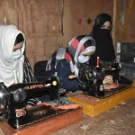 Women learning tailing skills through JKHCA's Empowerment Program