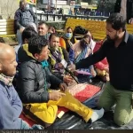 Representatives of JKHCA speaking with a journalist during a protest