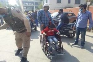 A Member of JKHCA on a wheelchair during a protest at Press Enclave Srinagar