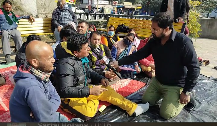 Representatives of JKHCA speaking with a journalist during a protest